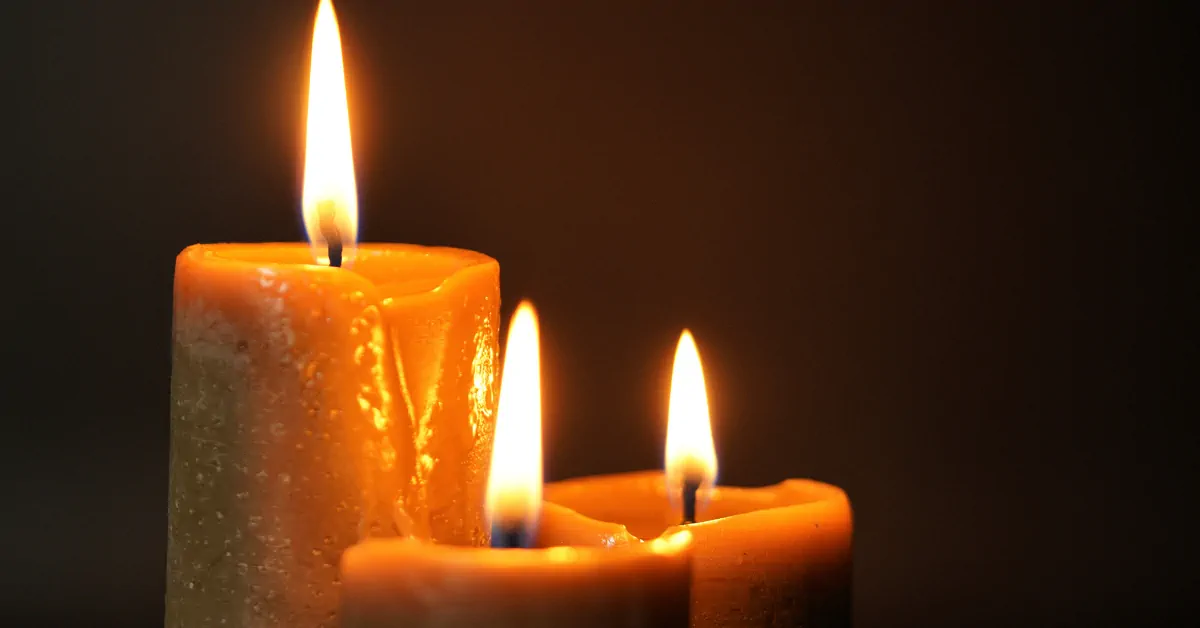 An image of candles in the darkness representing dealing with loss
