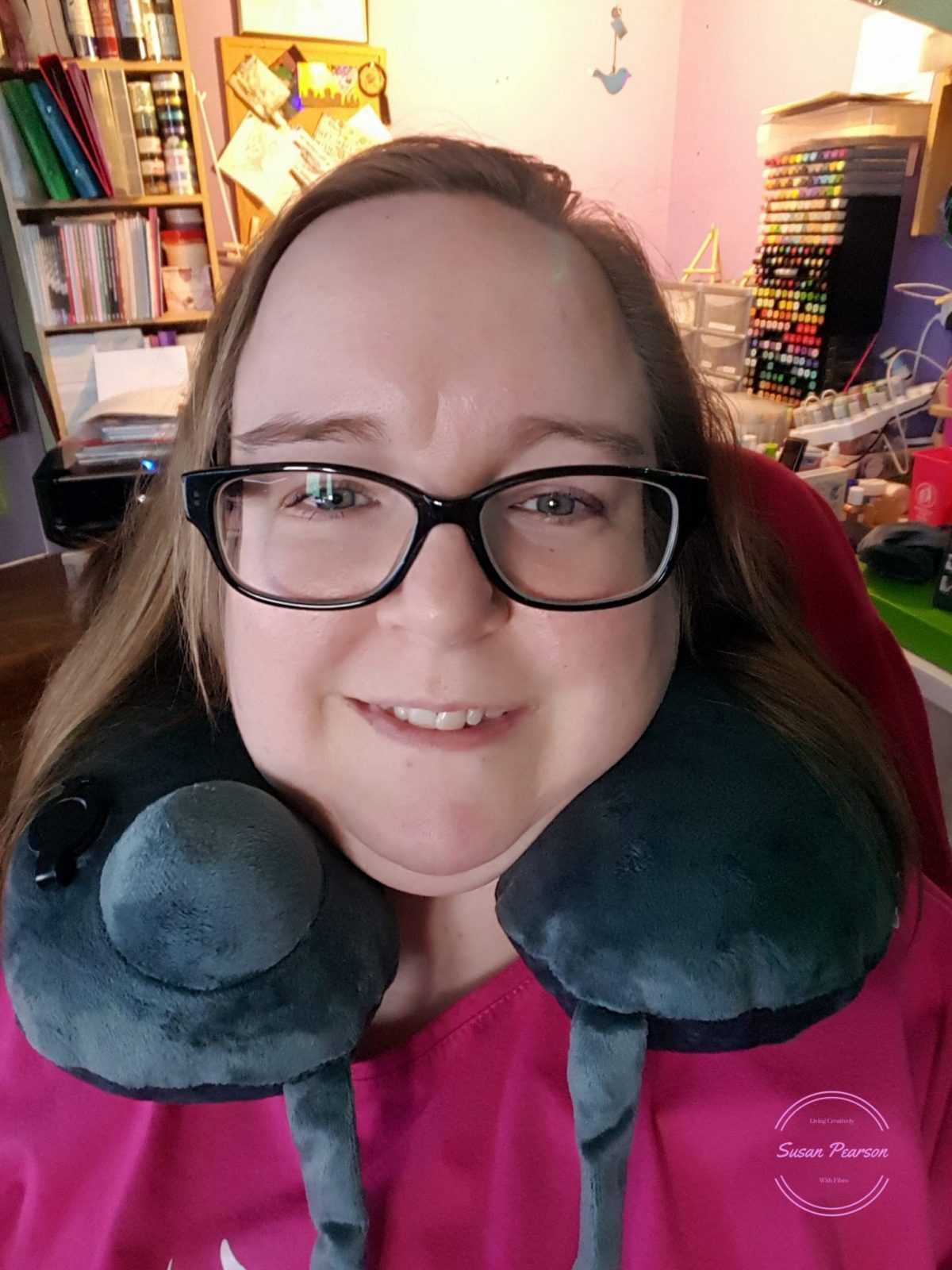Living Creatively with Fibro | Using the Bedtime Bliss Travel Pillow sat at the desk
