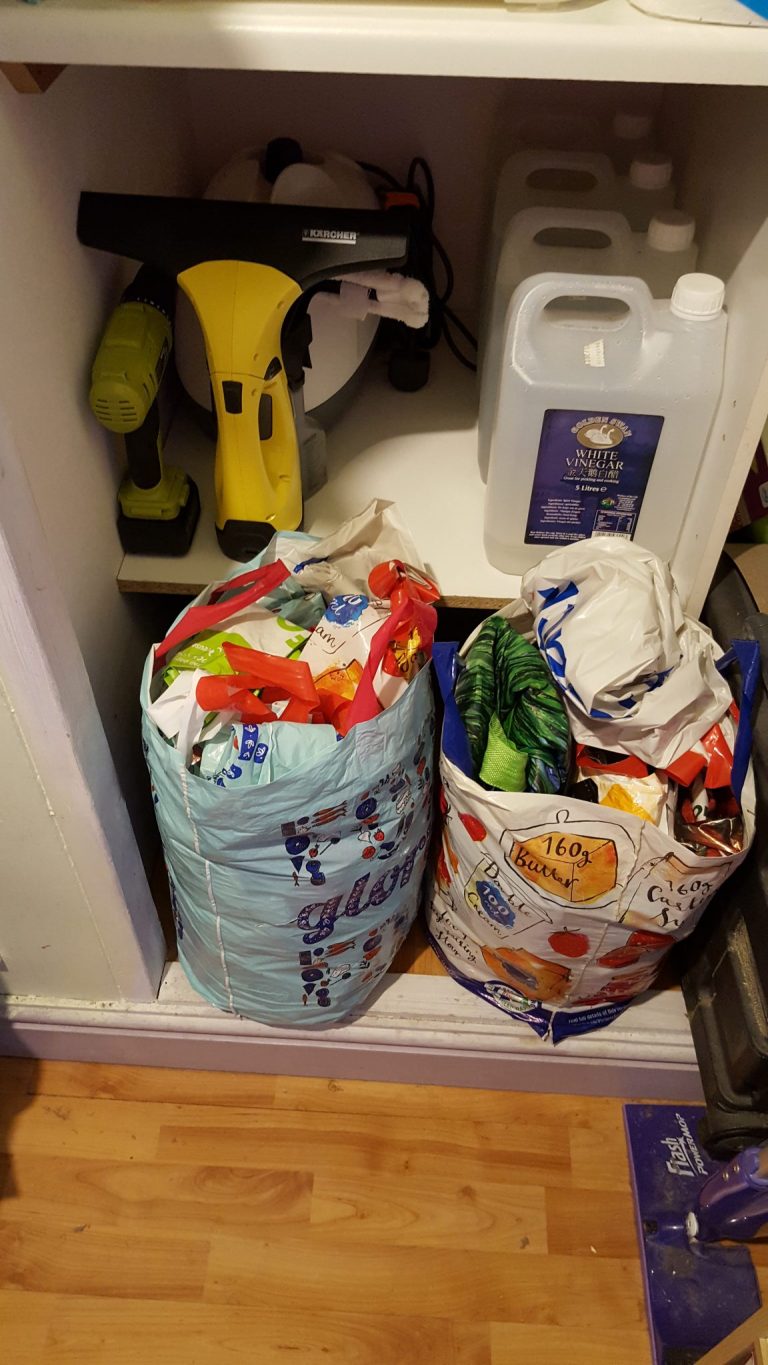 Living Creatively with Fibro | The bags full of bags temporarily blocking the bottom shelf of the cupboard