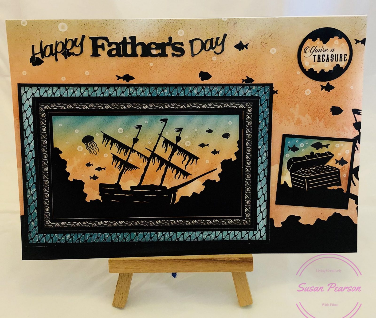 Living Creatively with Fibro | Father's Day 2018 card for Dad featuring a silhouette image of of a sunken ship surrounded by fish in orange and aqua shades