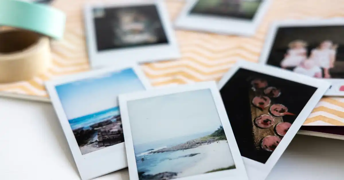 Polaroid prints of beaches, food & people scattered on yellow chevron paper with tape, for digital scrapbooking.